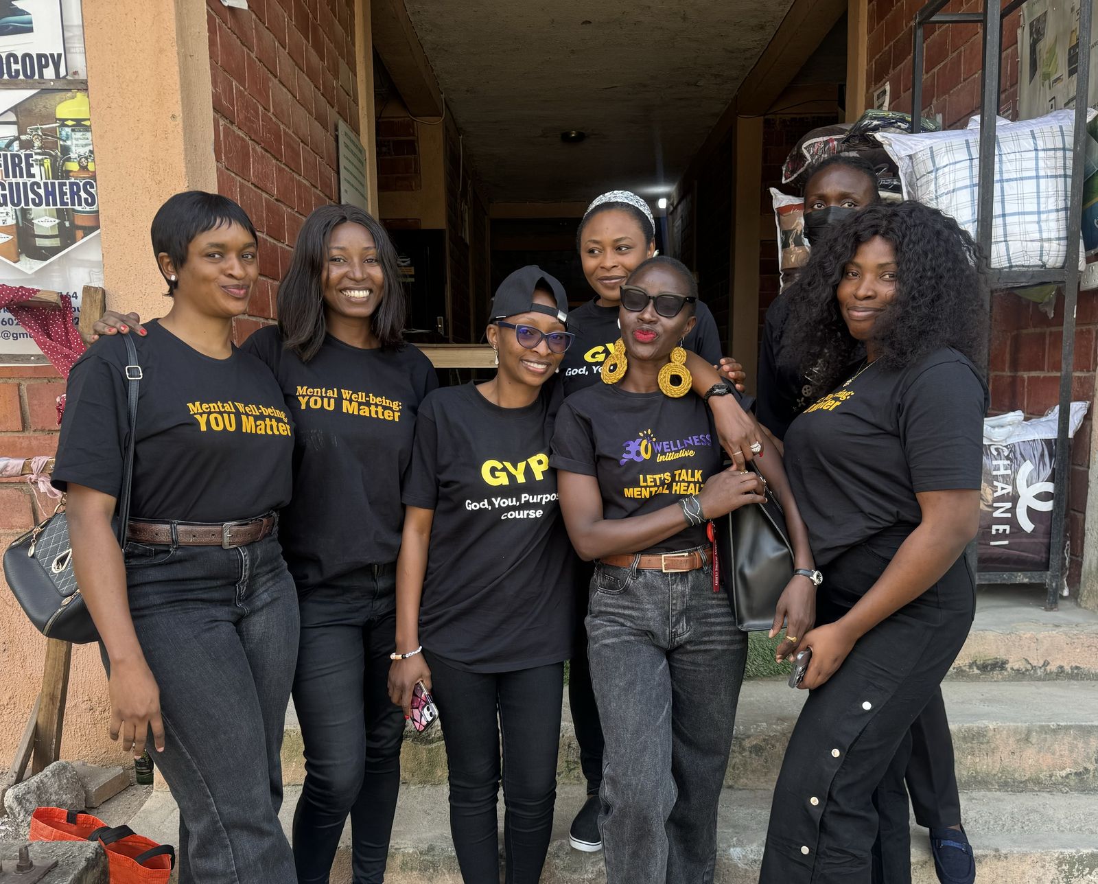 Wellness 360 Initiative team members in branded shirts at an outreach event