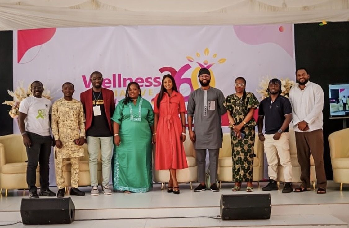 Speakers and guests on stage at the Wellness 360 World Mental Health Day conference