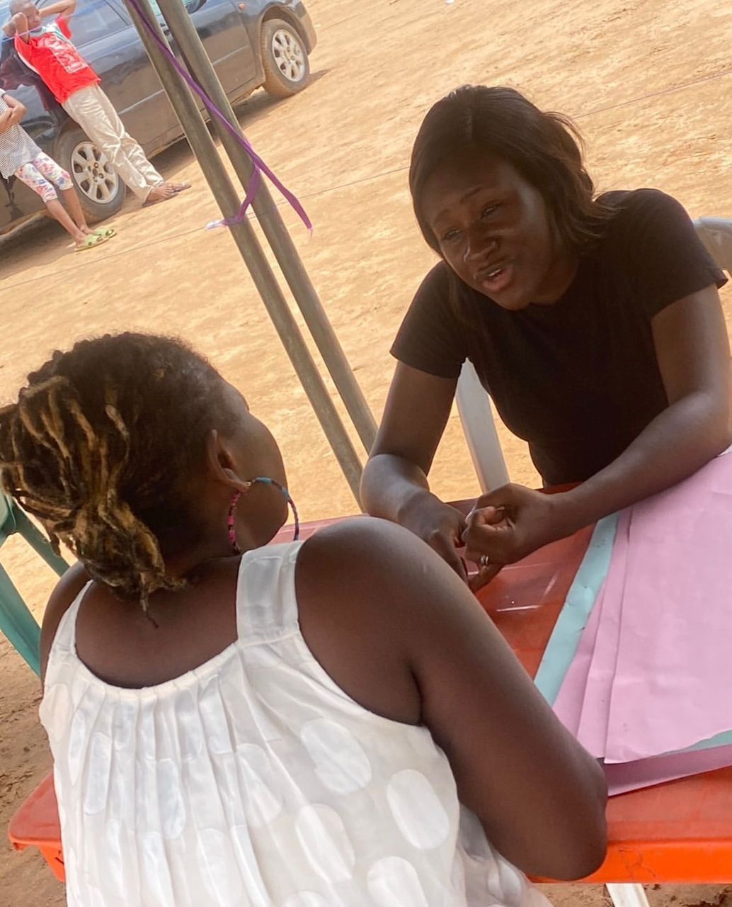 A volunteer attending to children at the Wamba community outreach