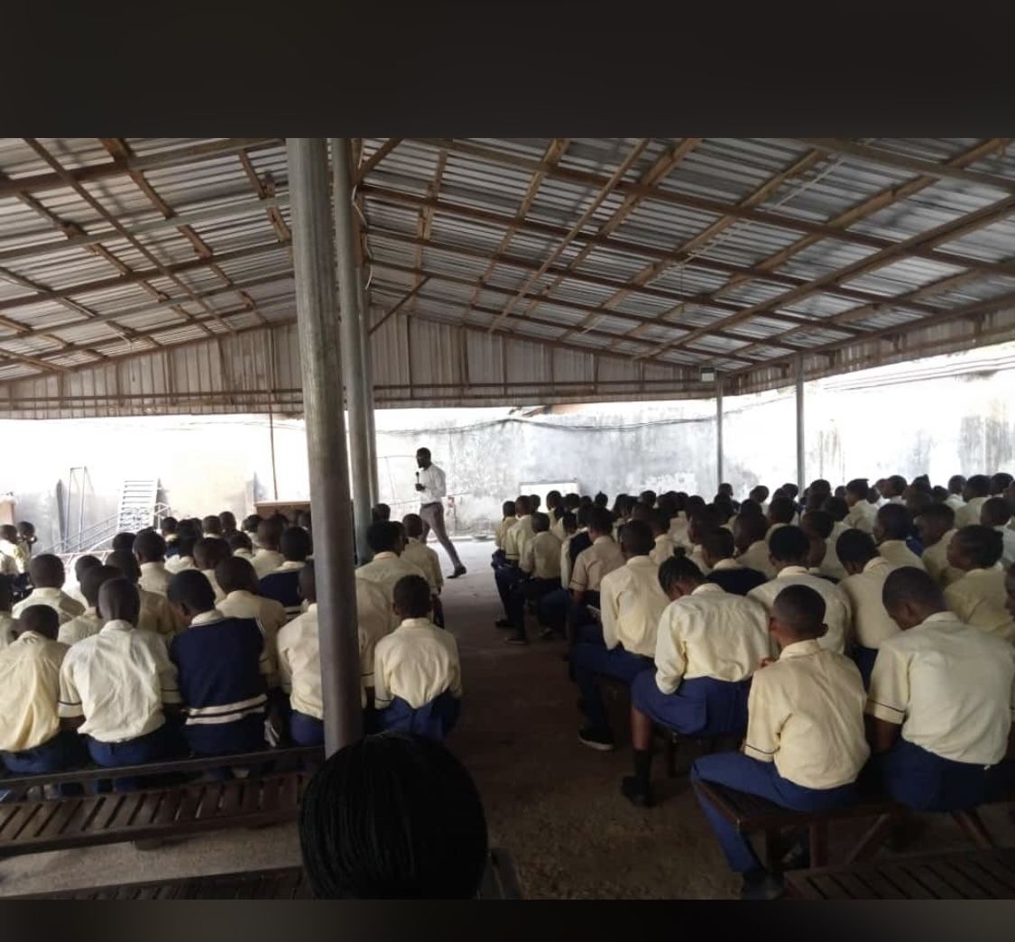 Students seated in rows at a school mental health awareness session