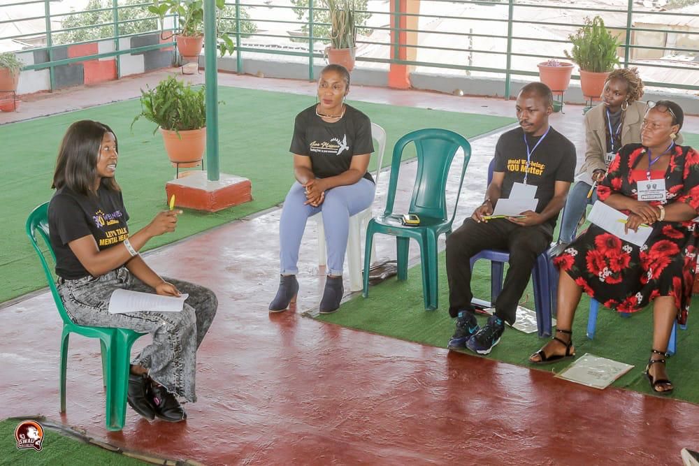 A group counselling circle in session, participants listening to one another